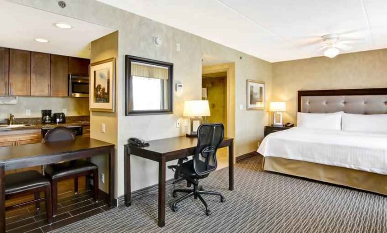 King room with king size bed, living area and private kitchen at the Homewood Suites by Hilton Toronto-Markham.