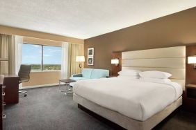 Oversized king room with sofa bed, dining and living Area at the DoubleTree by Hilton Orlando Downtown.