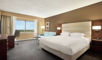 Oversized king room with sofa bed, dining and living Area at the DoubleTree by Hilton Orlando Downtown.