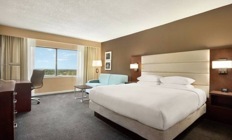 Oversized king room with sofa bed, dining and living Area at the DoubleTree by Hilton Orlando Downtown.