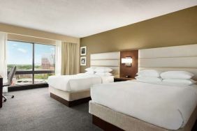 2 queen size beds in a bright room with TV screen and great view at the DoubleTree by Hilton Orlando Downtown.