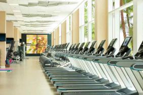 Fully equipped fitness center with treadmills and weights at the Hilton Orlando.