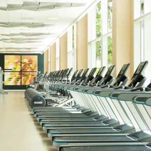 Fully equipped fitness center with treadmills and weights at the Hilton Orlando.