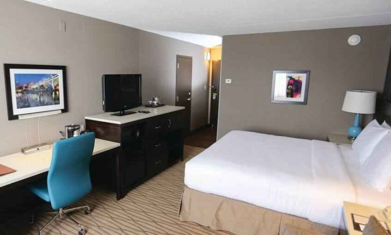 Beautiful workspace with king size bed, desk and TV screen at the DoubleTree by Hilton Cleveland Westlake.