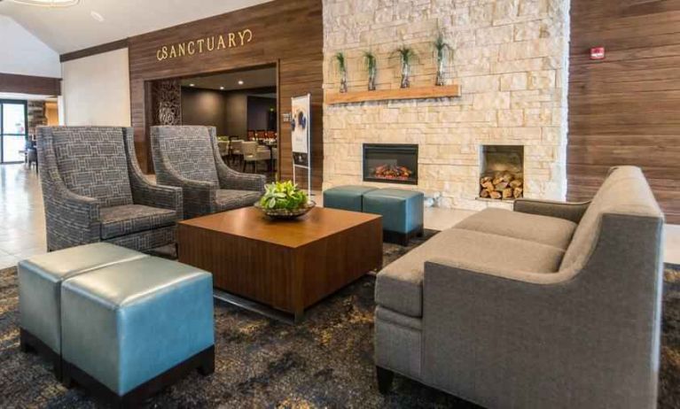 Elegant lounge area with sofa and chairs at the DoubleTree by Hilton Cleveland Westlake.