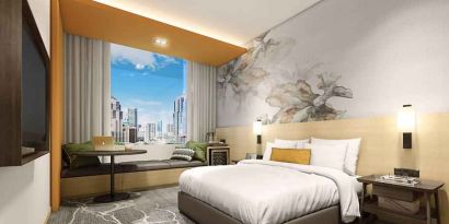 King bedroom with window and view at the Hilton Garden Inn Kuala Lumpur Jalan Tuanku Abdul Rahman North.