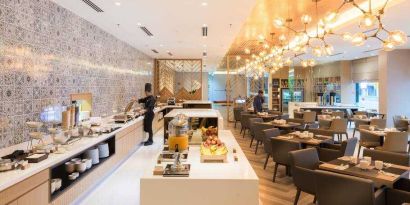 Elegant restaurant area with buffet at the Hilton Garden Inn Kuala Lumpur Jalan Tuanku Abdul Rahman North.