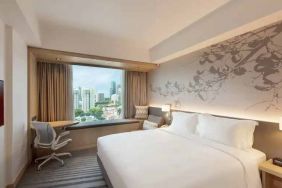 King size bed in a deluxe room with great city view at the Hilton Garden Inn Singapore Serangoon.