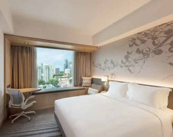 King size bed in a deluxe room with great city view at the Hilton Garden Inn Singapore Serangoon.