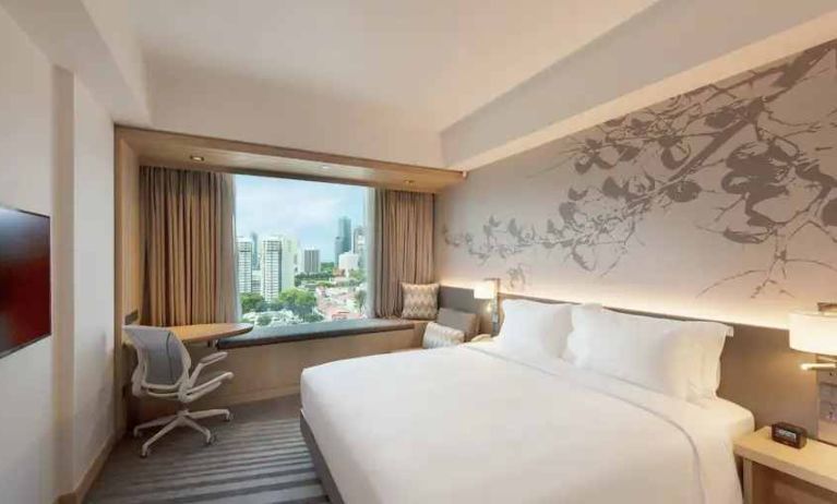 King size bed in a deluxe room with great city view at the Hilton Garden Inn Singapore Serangoon.