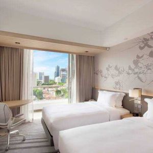 Deluxe twin bedroom with balcony for a great city view at the Hilton Garden Inn Singapore Serangoon.