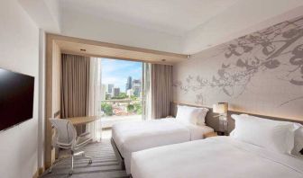 Deluxe twin bedroom with balcony for a great city view at the Hilton Garden Inn Singapore Serangoon.