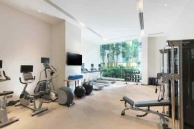 Fully equipped fitness center with treadmills and weights at the Hilton Garden Inn Singapore Serangoon.