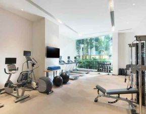 Fully equipped fitness center with treadmills and weights at the Hilton Garden Inn Singapore Serangoon.