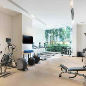 Fully equipped fitness center with treadmills and weights at the Hilton Garden Inn Singapore Serangoon.