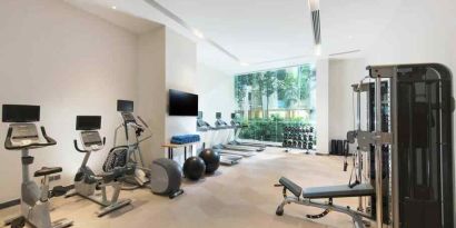 Fully equipped fitness center with treadmills and weights at the Hilton Garden Inn Singapore Serangoon.