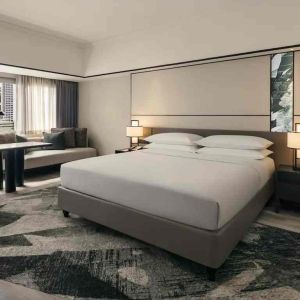 King size bed in a deluxe room with great city view at the Hilton Singapore Orchard.