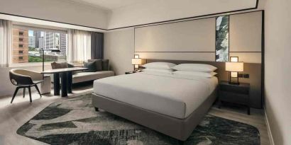 King size bed in a deluxe room with great city view at the Hilton Singapore Orchard.