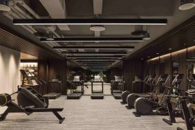 Stylish fitness center with treadmills and excercise bikes at the Hilton Singapore Orchard.