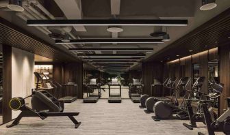 Stylish fitness center with treadmills and excercise bikes at the Hilton Singapore Orchard.