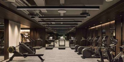 Stylish fitness center with treadmills and excercise bikes at the Hilton Singapore Orchard.