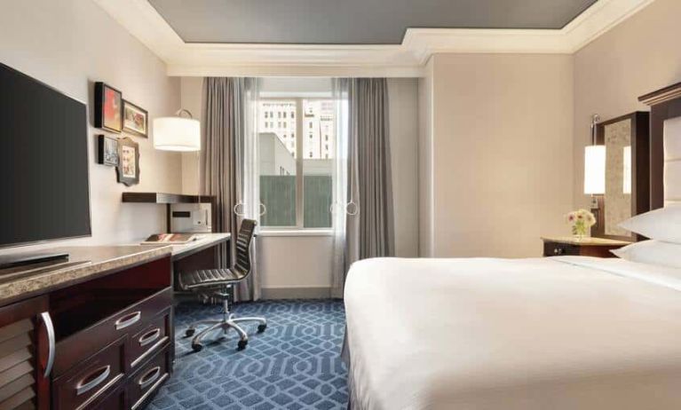 King suite with a dedicated workstation and view of downtown Los Angeles.