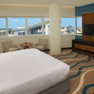 King size bed with 42 inch tv, minibar, and bathroom