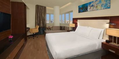 Spacious King sized room with king bed with private balcony at the DoubleTree by Hilton Hotel and Residences Dubai Al Barsha