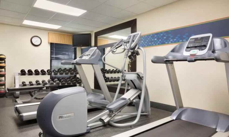 Fitness center with tradmill and exercising bike at the Hampton Inn Orlando International Drive Convention Center.