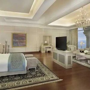 Deluxe suite with separate living room and sea view at the Waldorf Astoria Dubai Palm Jumeirah.