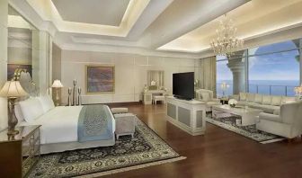 Deluxe suite with separate living room and sea view at the Waldorf Astoria Dubai Palm Jumeirah.