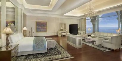 Deluxe suite with separate living room and sea view at the Waldorf Astoria Dubai Palm Jumeirah.