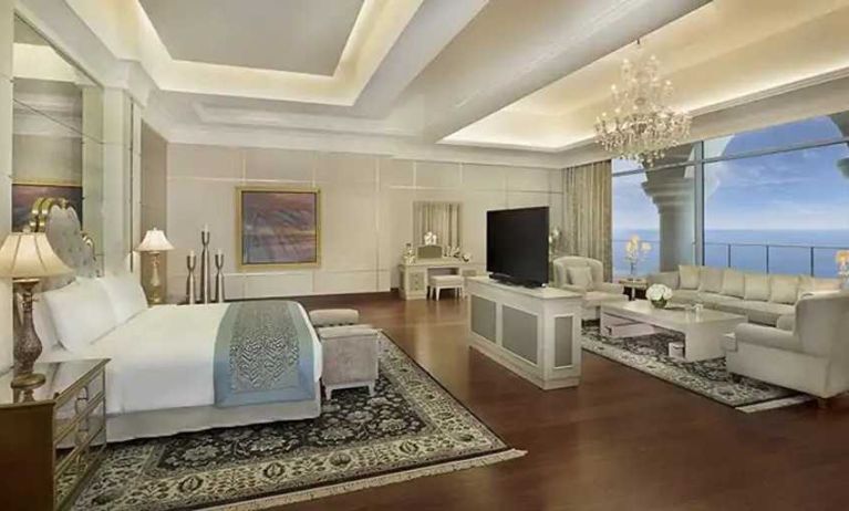 Deluxe suite with separate living room and sea view at the Waldorf Astoria Dubai Palm Jumeirah.