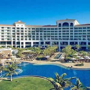 Beautiful outdoors with garden and pool at the Waldorf Astoria Dubai Palm Jumeirah.