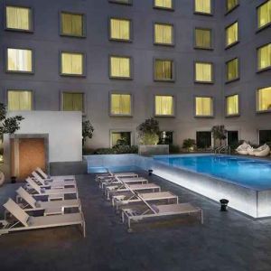 Relaxing outdoor pool area at the Hilton Garden Inn Dubai Mall of the Emirates.