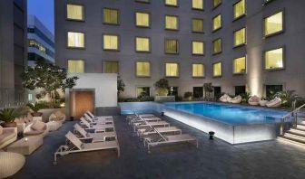 Relaxing outdoor pool area at the Hilton Garden Inn Dubai Mall of the Emirates.