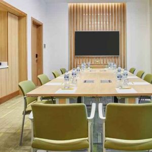 Meeting room with square conference table at the Hilton Garden Inn Dubai Mall of the Emirates.