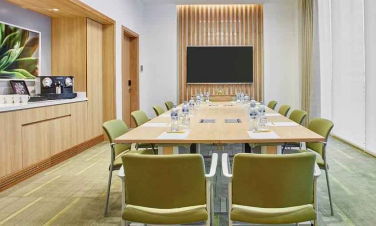 Meeting room with square conference table at the Hilton Garden Inn Dubai Mall of the Emirates.