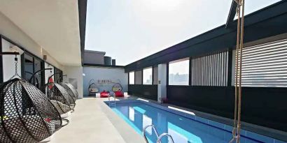 Relaxing rooftop with pool at the Hampton by Hilton Dubai Al Seef.