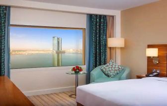 Bright queen room with amazing creek view at the Hilton Ras Al Khaimah Beach Resort.