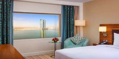 Bright queen room with amazing creek view at the Hilton Ras Al Khaimah Beach Resort.