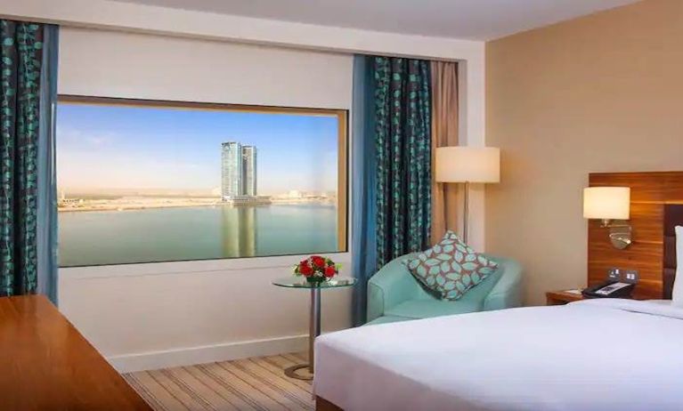 Bright queen room with amazing creek view at the Hilton Ras Al Khaimah Beach Resort.