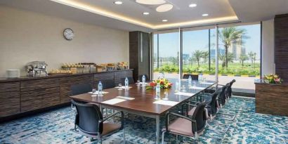 Bright meeting room perfect for small groups at the Hilton Ras Al Khaimah Beach Resort.