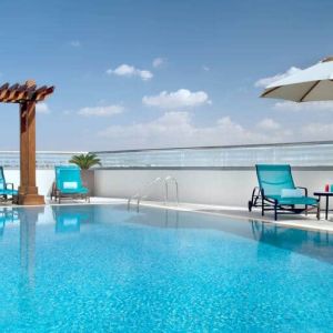 Beautiful outdoor pool at the Hilton Garden Inn Dubai Al Muraqabat