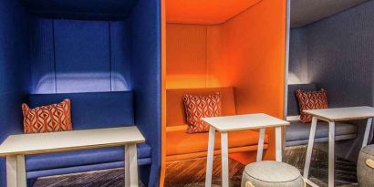 Comfortable and colorful work space cubicles at Tru by Hilton Bowling Green.