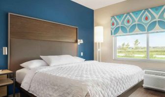 King-sized room with natural light at Tru by Hilton Milwaukee Brookfield.