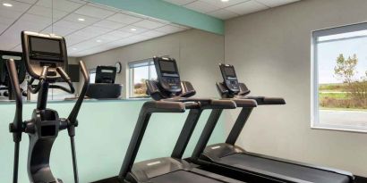 Equipped fitness center at Tru by Hilton Milwaukee Brookfield.