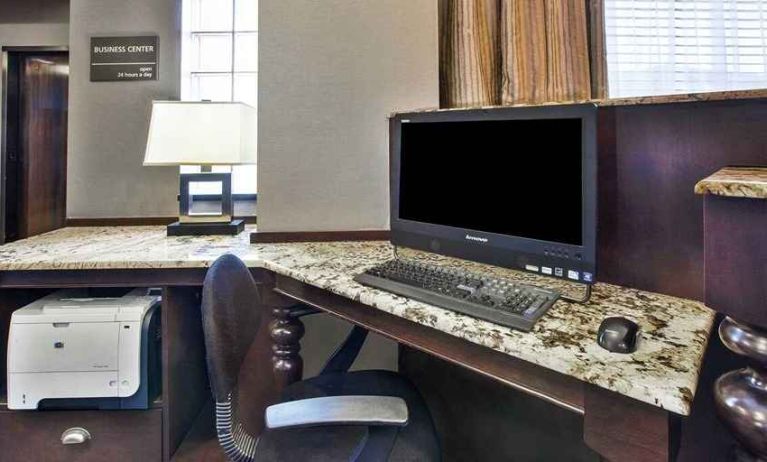 Equipped work station for coworking or individual work Delux king bed with work desk at Hampton Inn Pittsburgh University/Medical Center.