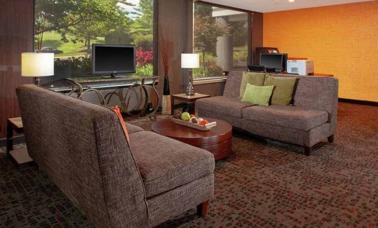 Comfortable lobby, business area, and coworking space at DoubleTree Suites by Hilton Hotel Dayton - Miamisburg.