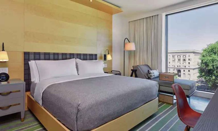 King guestroom with window view at the Embassy Suites by Canopy by Hilton Portland Pearl District.